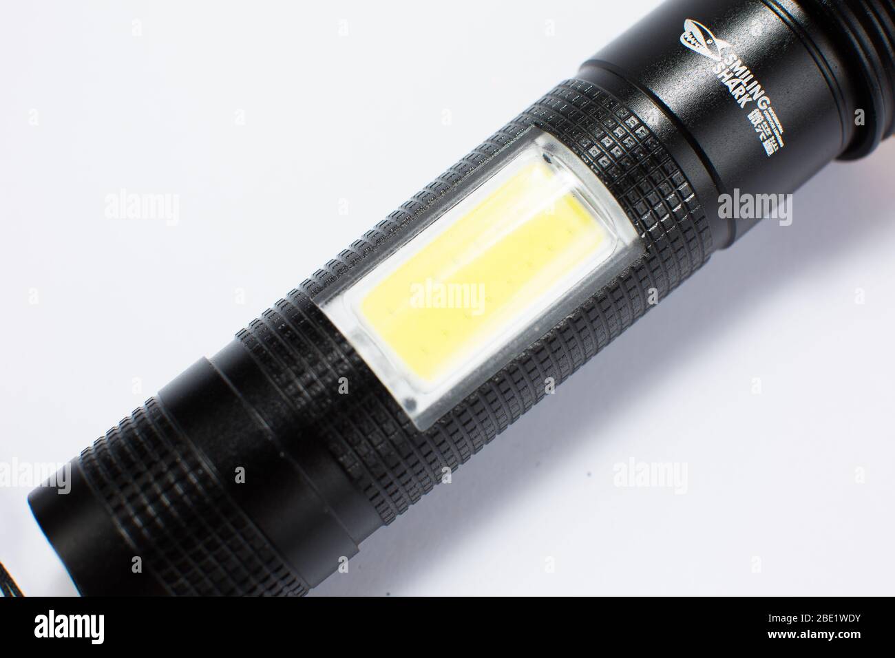modern black metal flashlight isolated on white background Stock Photo