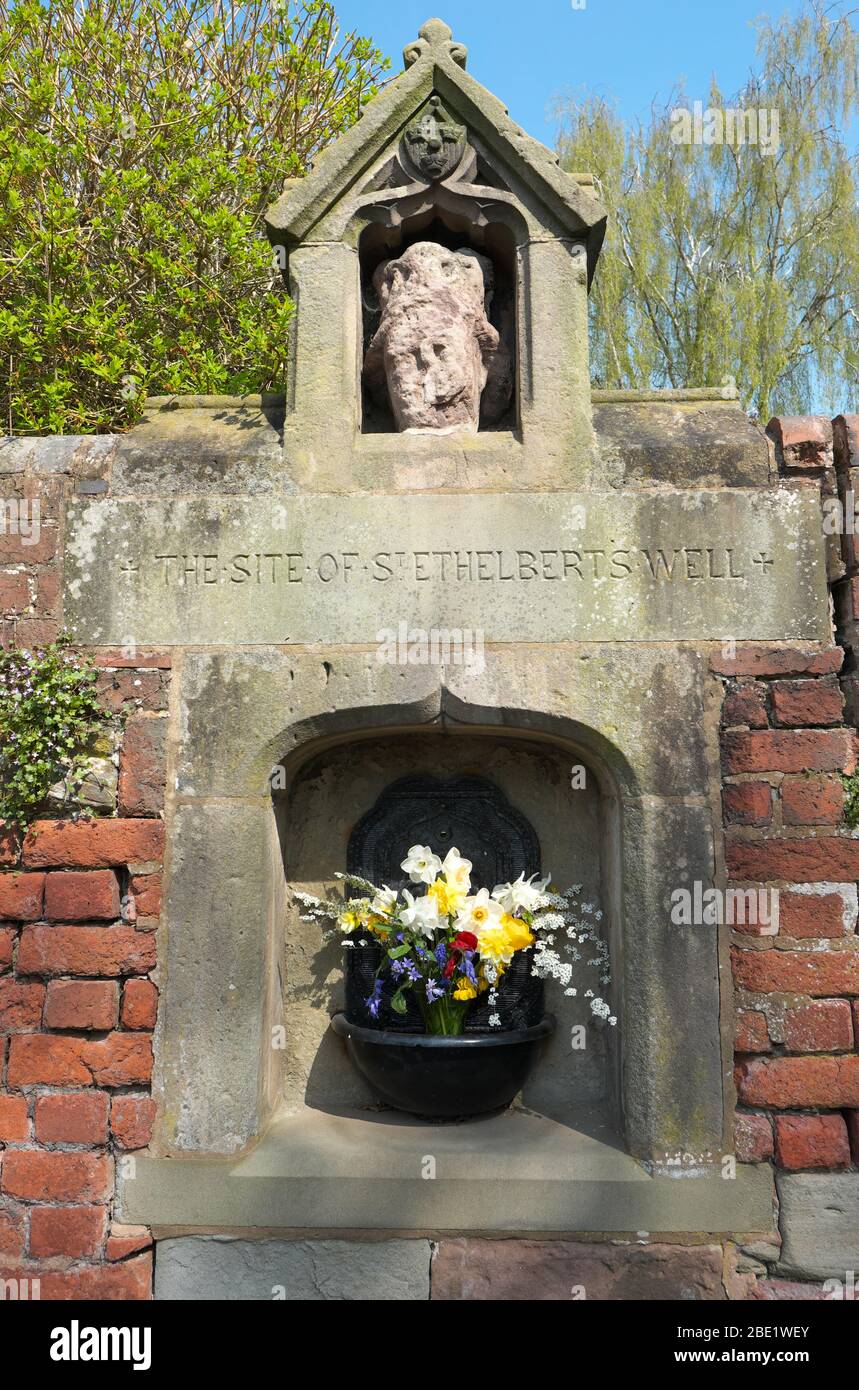 Hereford UK - site of St Ethelbert's Well with flowers at the junction of Castle Hill and Quay Street Hereford UK Stock Photo
