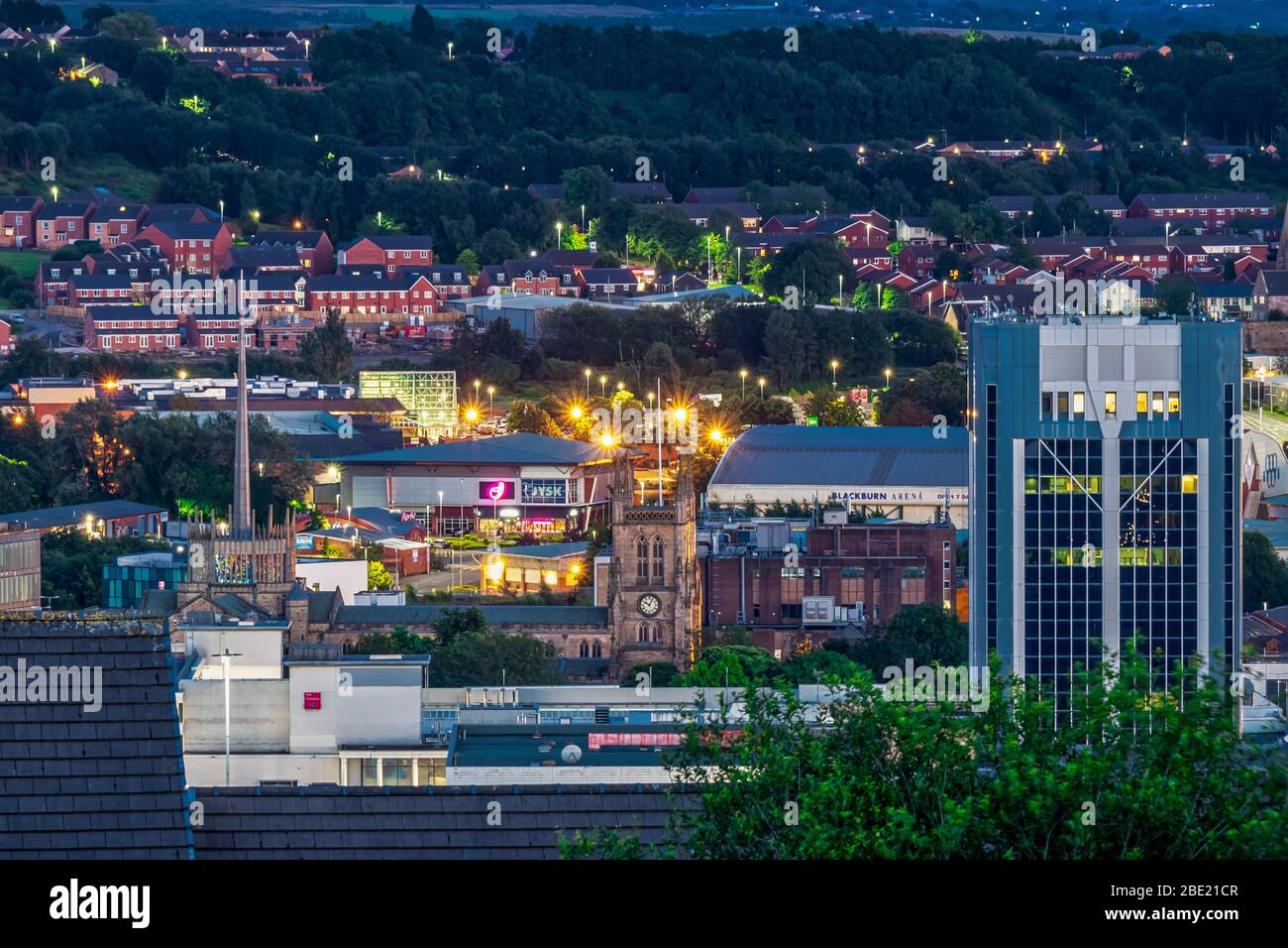View of Blackburn Town Centre in the evening featuring the Blackburn Town Hall and Blackburn Cathedral Stock Photo