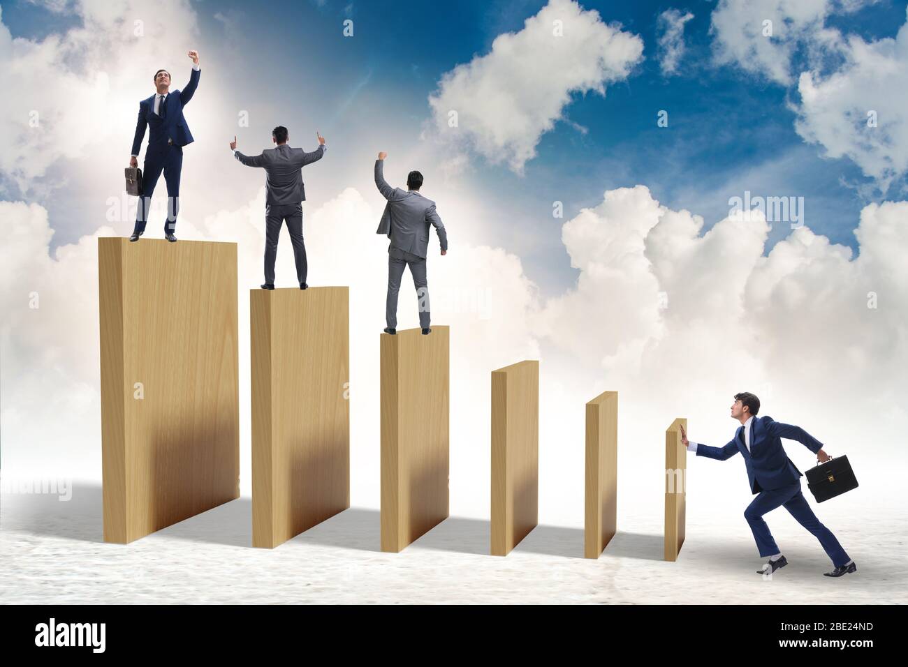 Domino effect and the competition concept Stock Photo - Alamy
