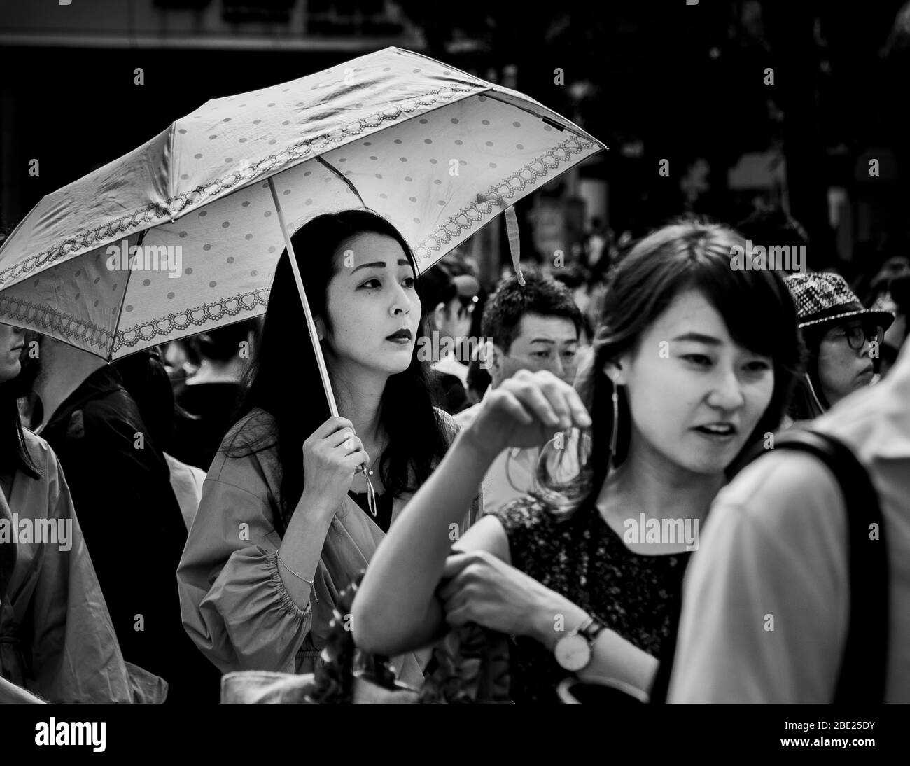 Pedestrian scene with umbrella and Street Life in Tokyo, Japan Stock Photo