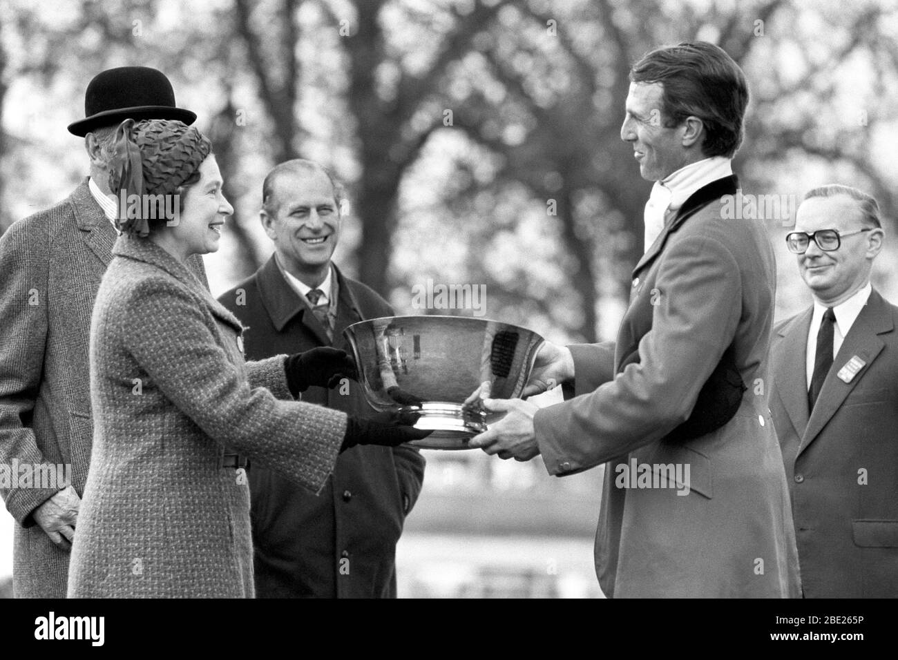 File photo dated 12/04/1981 of Prince Philip, Duke of Edinburgh (centre) watches the Queen and their son-in-law Captain Mark Phillips at the presentation ceremony after Phillips won the Badminton Horse Trials for the fourth time Stock Photo