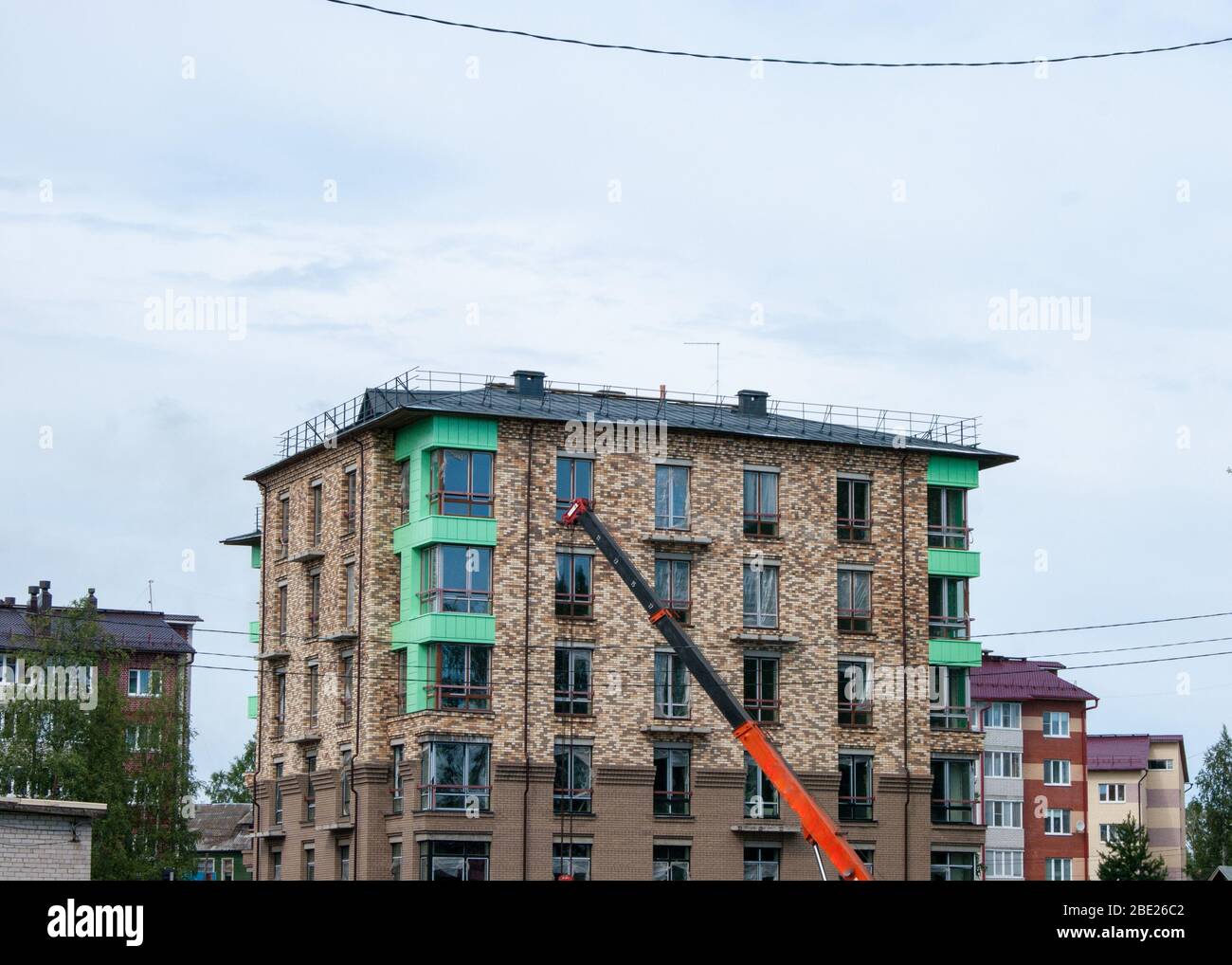 Construction crane reaches new hi-res stock photography and images - Alamy