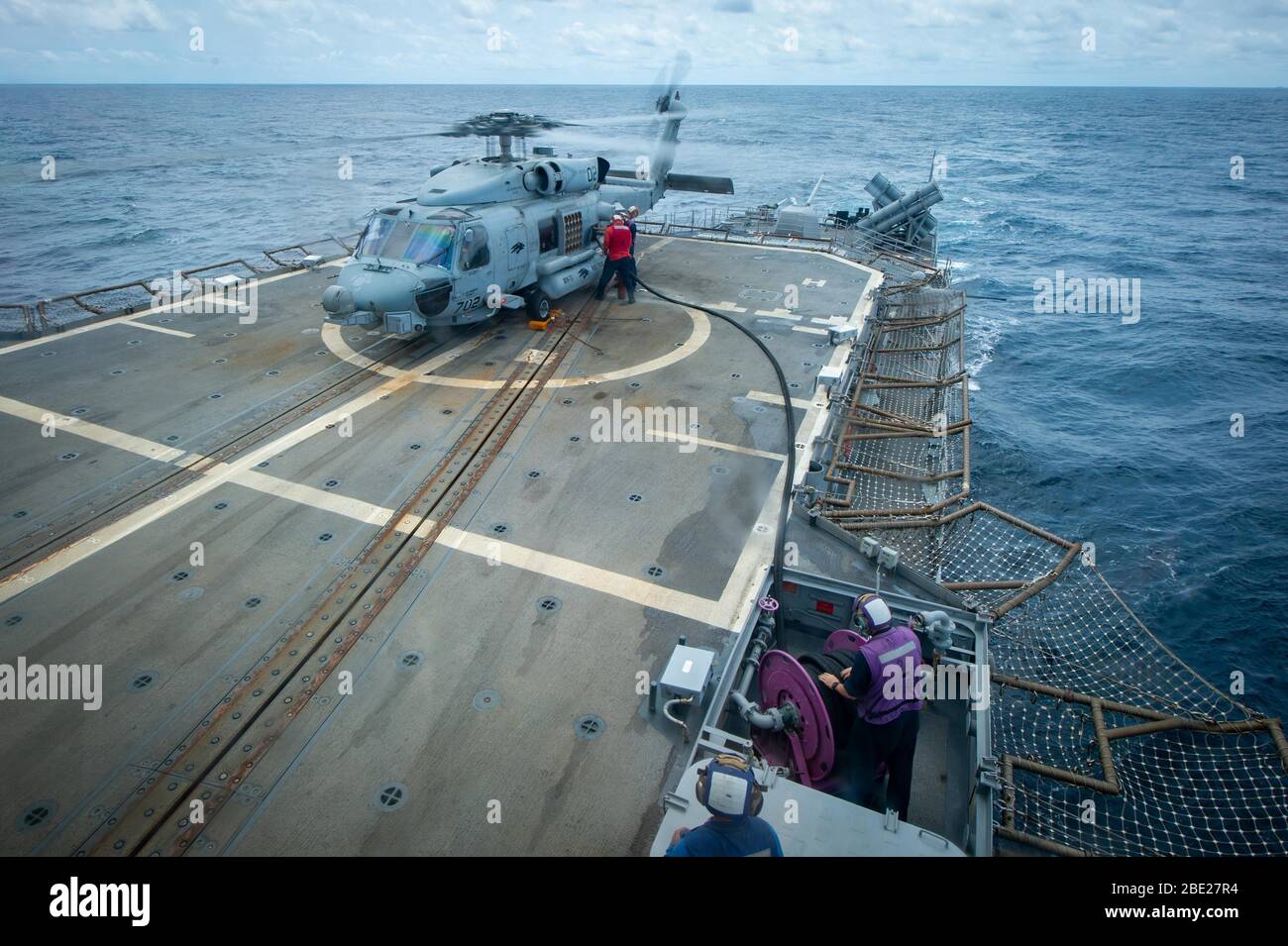 SOUTH CHINA SEA (April 7, 2020) U.S. Navy Sailors refuel a MH-60R Sea ...