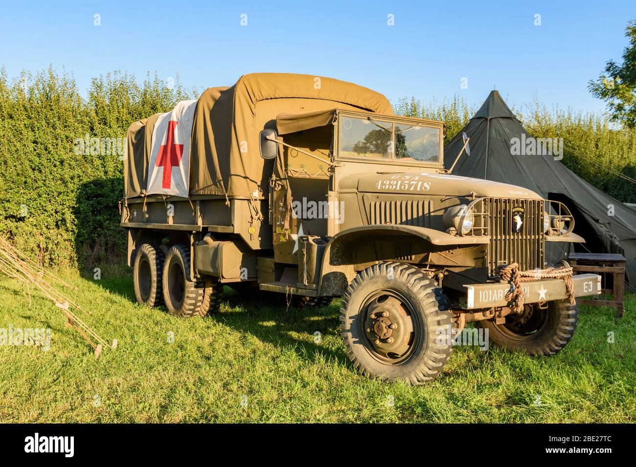 A GMC Deuce and a Half 'Jimmy' in 101 AB colours carrying an ambulance flag at a World War 2 re-enactment event Stock Photo