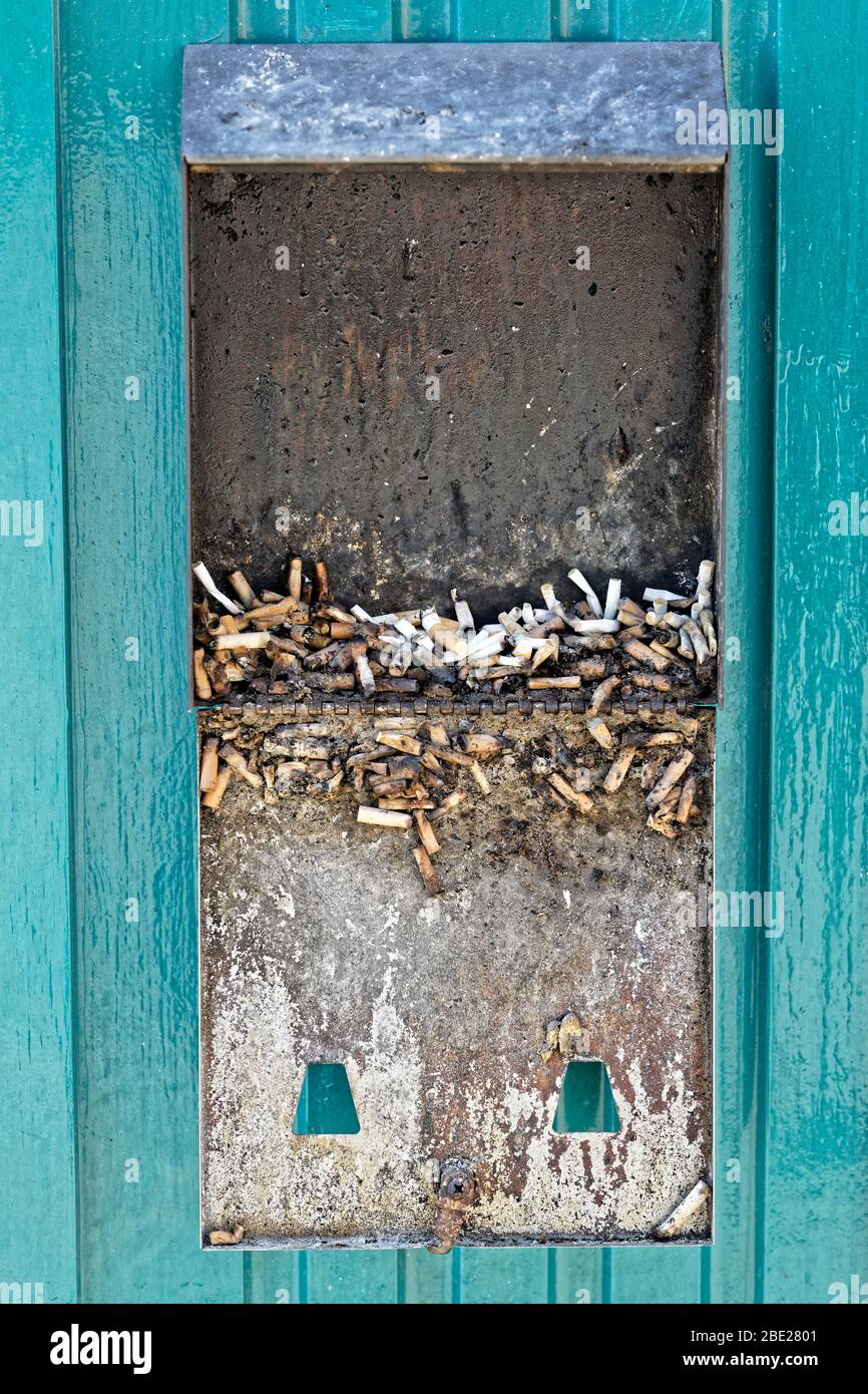 An open cigarette disposal bin in Union Street, Swansea, Wales, UK. Thursday 26 March 2020 Stock Photo