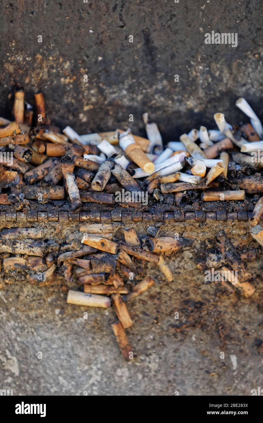 An open cigarette disposal bin in Union Street, Swansea, Wales, UK. Thursday 26 March 2020 Stock Photo