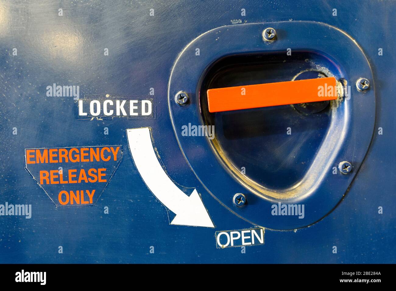 Emergency release handle on the side of an aircraft Stock Photo