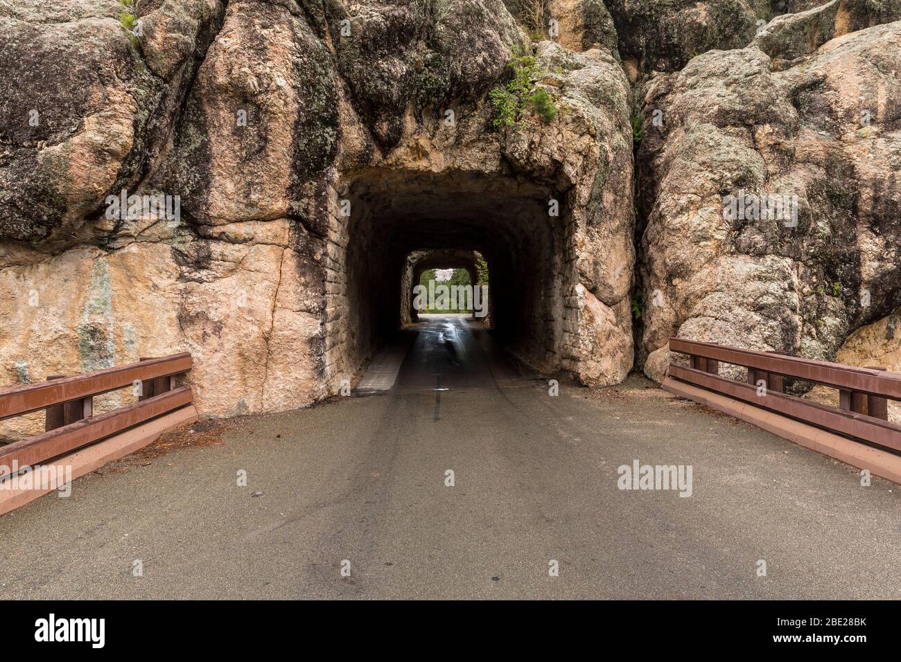Two Narrow Tunnels On A Road In The Black Hills Of South Dakota Stock Photo Alamy