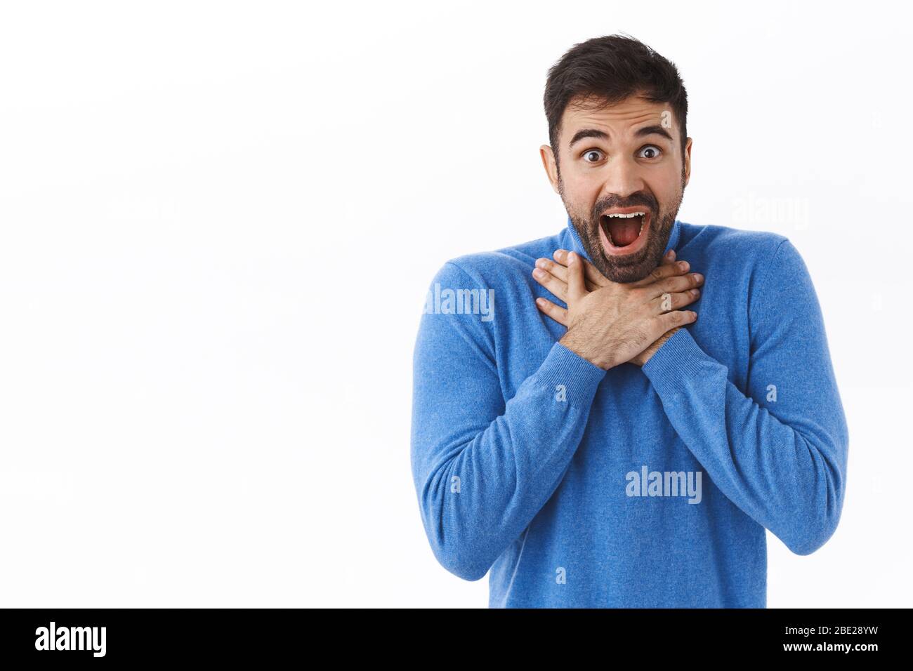 Portrait of speechless, impressed handsome man, lose his speech