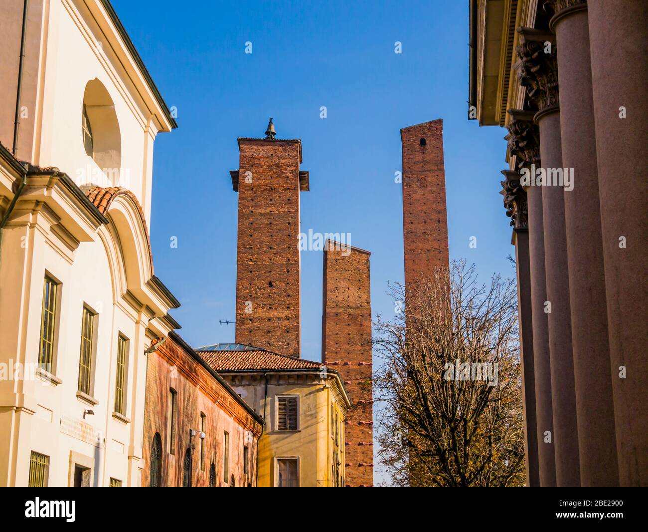 Medieval brick towers in front of the university building, Pavia, Lombardy region, northern Italy Stock Photo