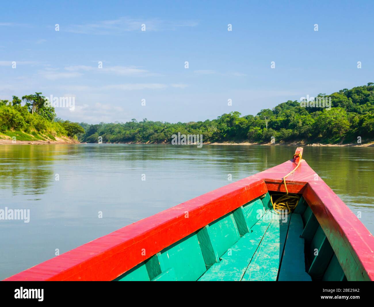 Colorful tourist boat sails on Usumacinta river for Yaxchilan archaeological site, Chiapas, Mexico-Guatemala border Stock Photo