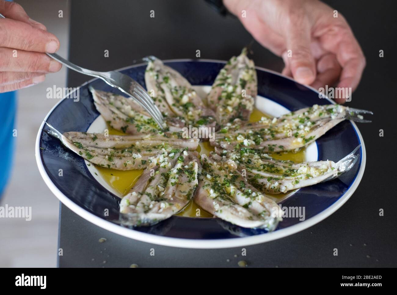 Anchovies with garlic and parsley, Asturias, northern Spain Stock Photo