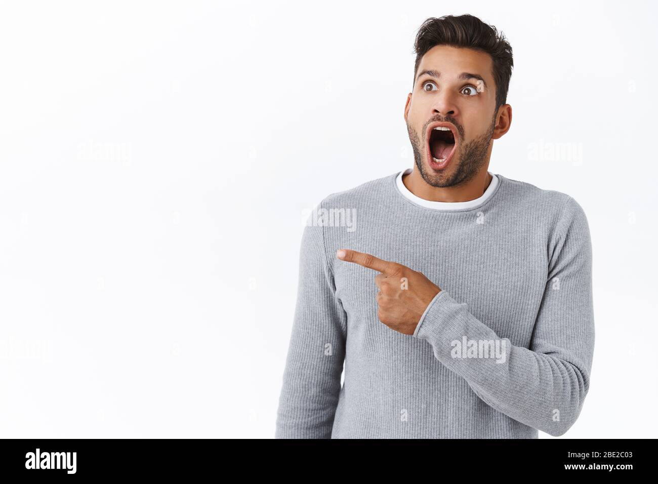 Guy check out fantastic event, drop jaw from excitement, surprise and  amazement. Attractive young wondered man open mouth in awe and astonishment  Stock Photo - Alamy