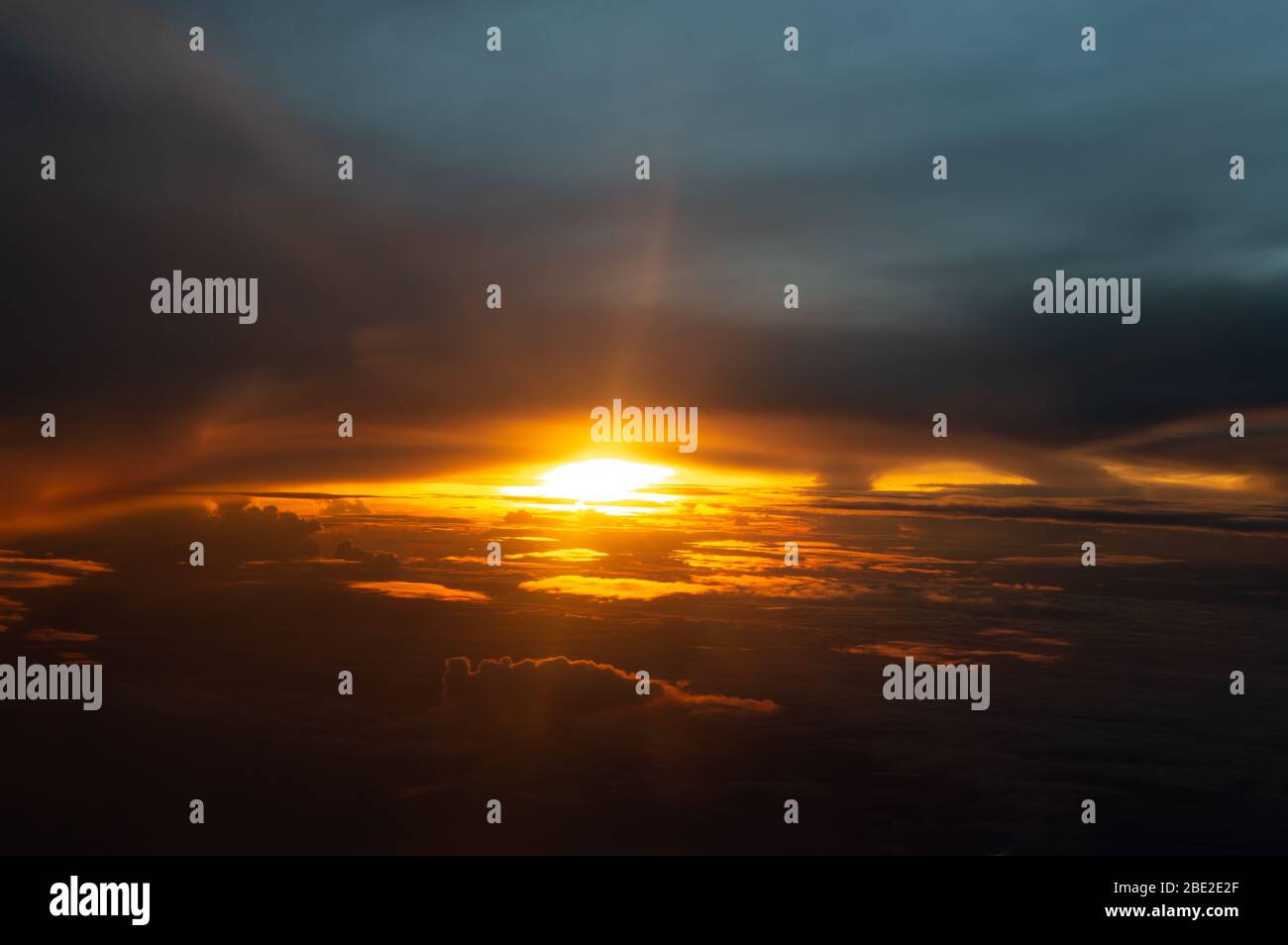 Aerial view of the sun over the clouds Stock Photo
