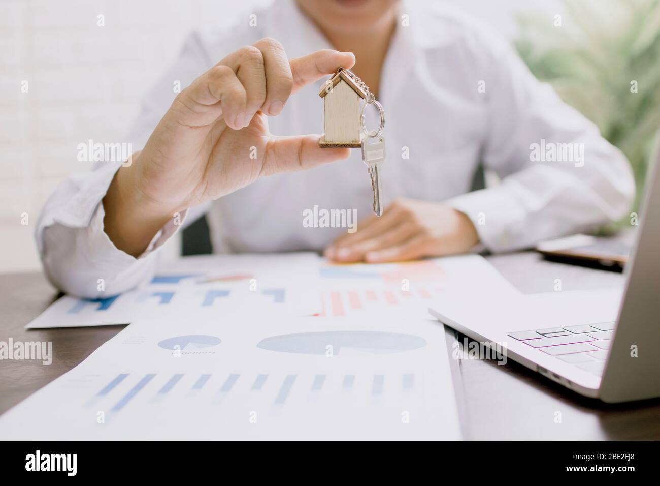 business man holding house model, real estate concept Stock Photo - Alamy