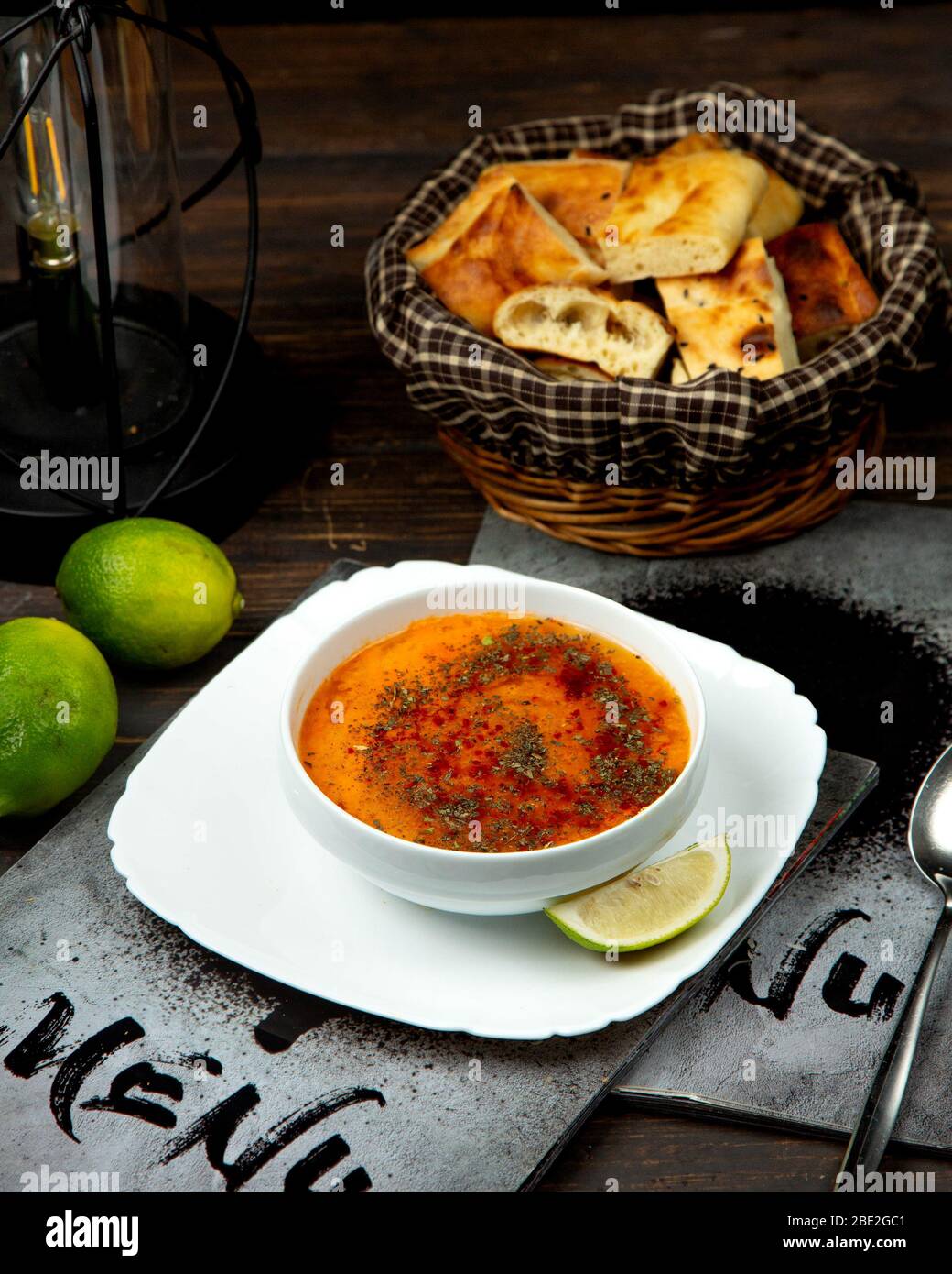 lentil soup sprinkled with spices and a slice of lemon Stock Photo