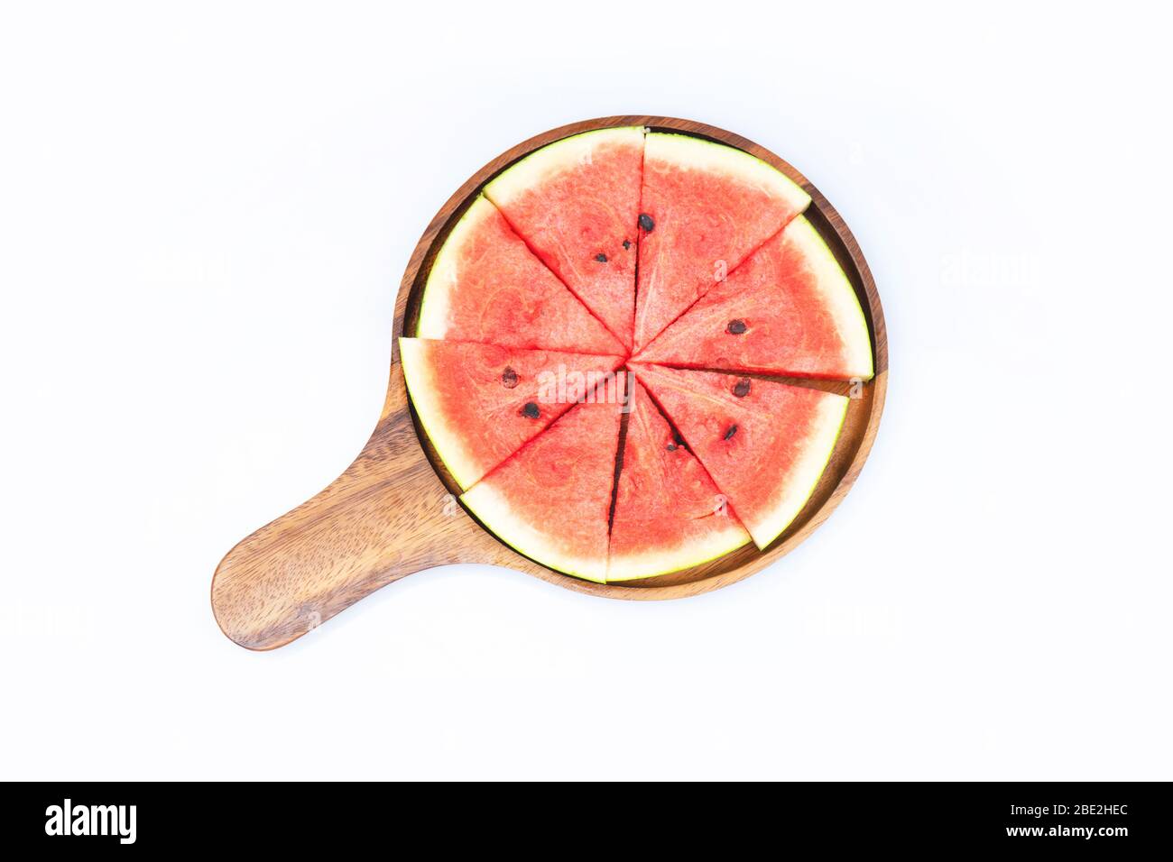 top view of watermelon on wooden tray isolated on white background ...