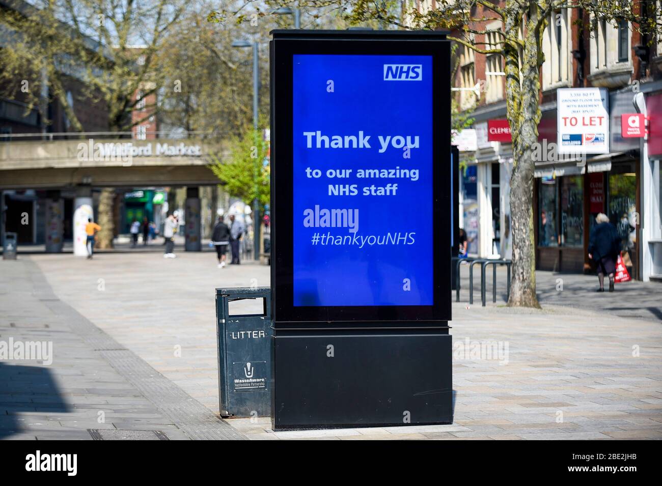 Watford, UK.  11 April 2020. A digital advertising screen in Watford shopping centre on Easter Saturday during lockdown as the coronavirus (COVID19) pandemic continues.  The screen shows a message thanking the NHS.  Credit: Stephen Chung / Alamy Live News Stock Photo