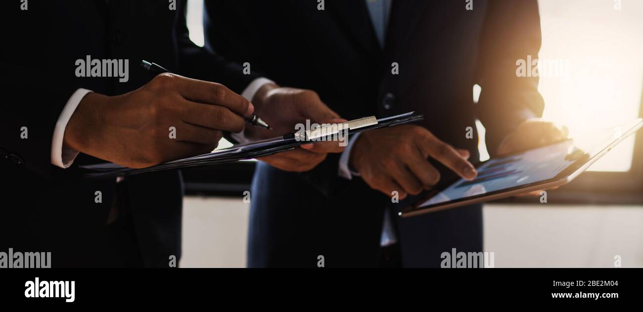close up hand of business people note information as standing meeting ...