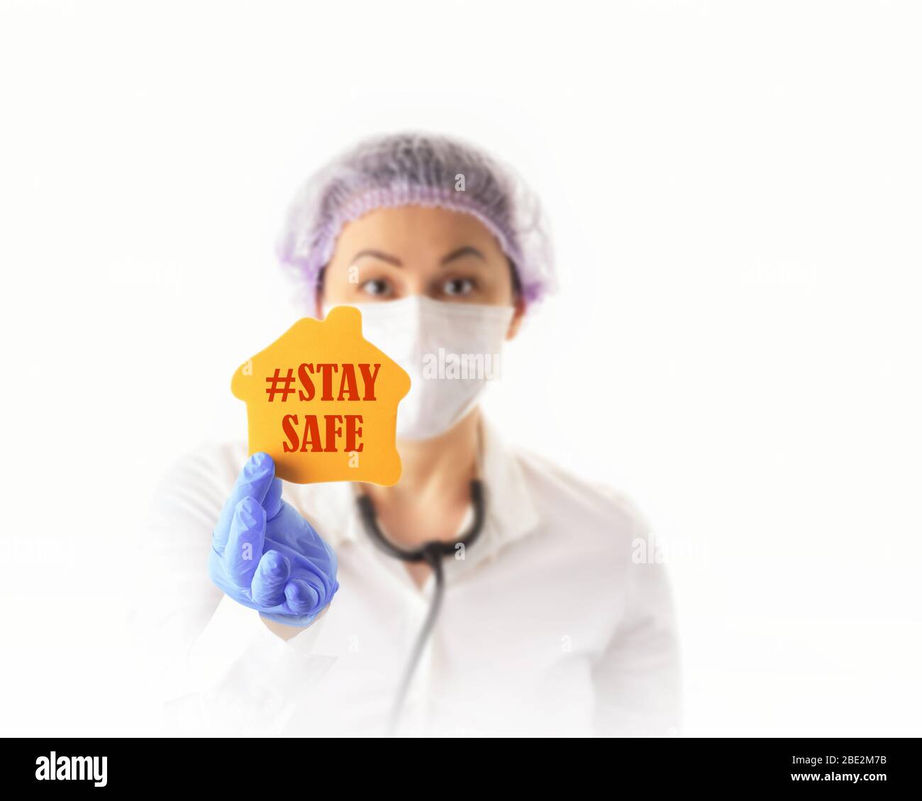 Nurse or Female Doctor  in Medical Protective Mask Showing Stay Safe. Prevention and Stop  coronavirus infection concept. Stock Photo
