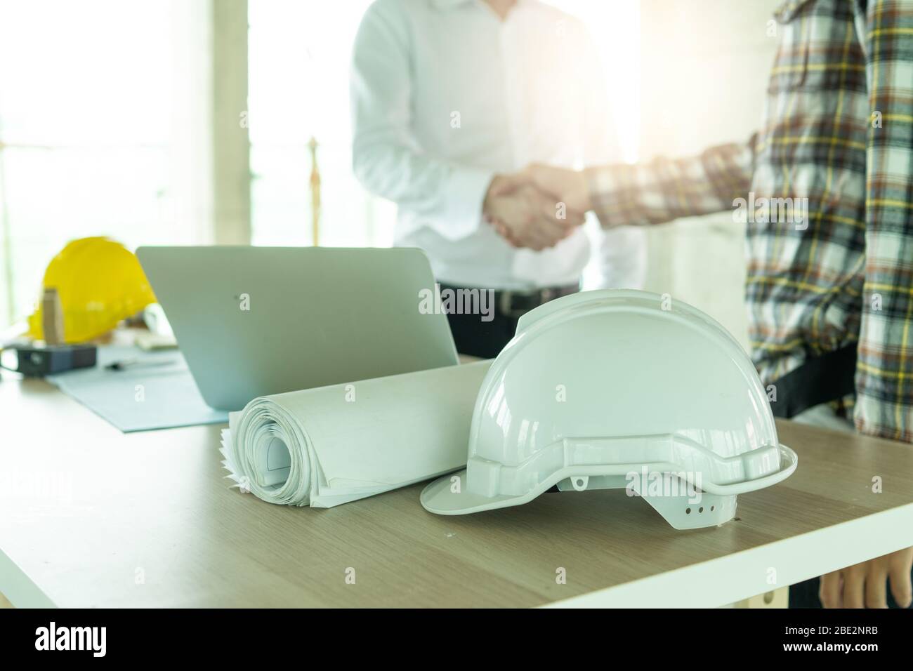 Close up engineer shaking hand with Stock Photo