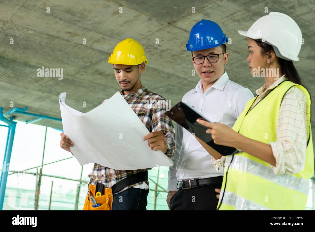 engineer planning with team architect in construction site Stock Photo