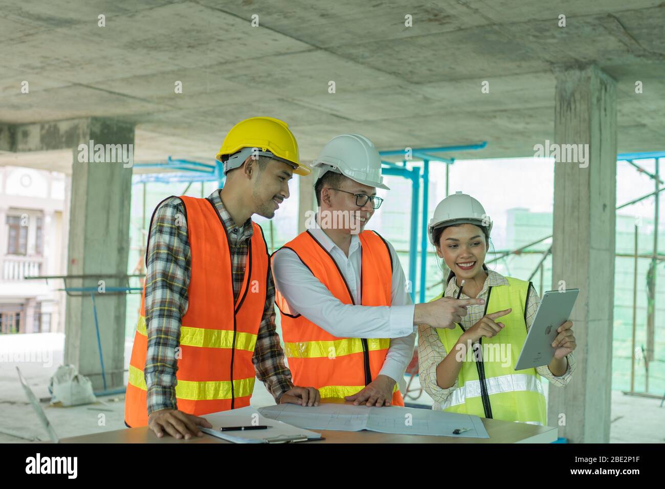 engineer planning with team architect with laptop on wood table in