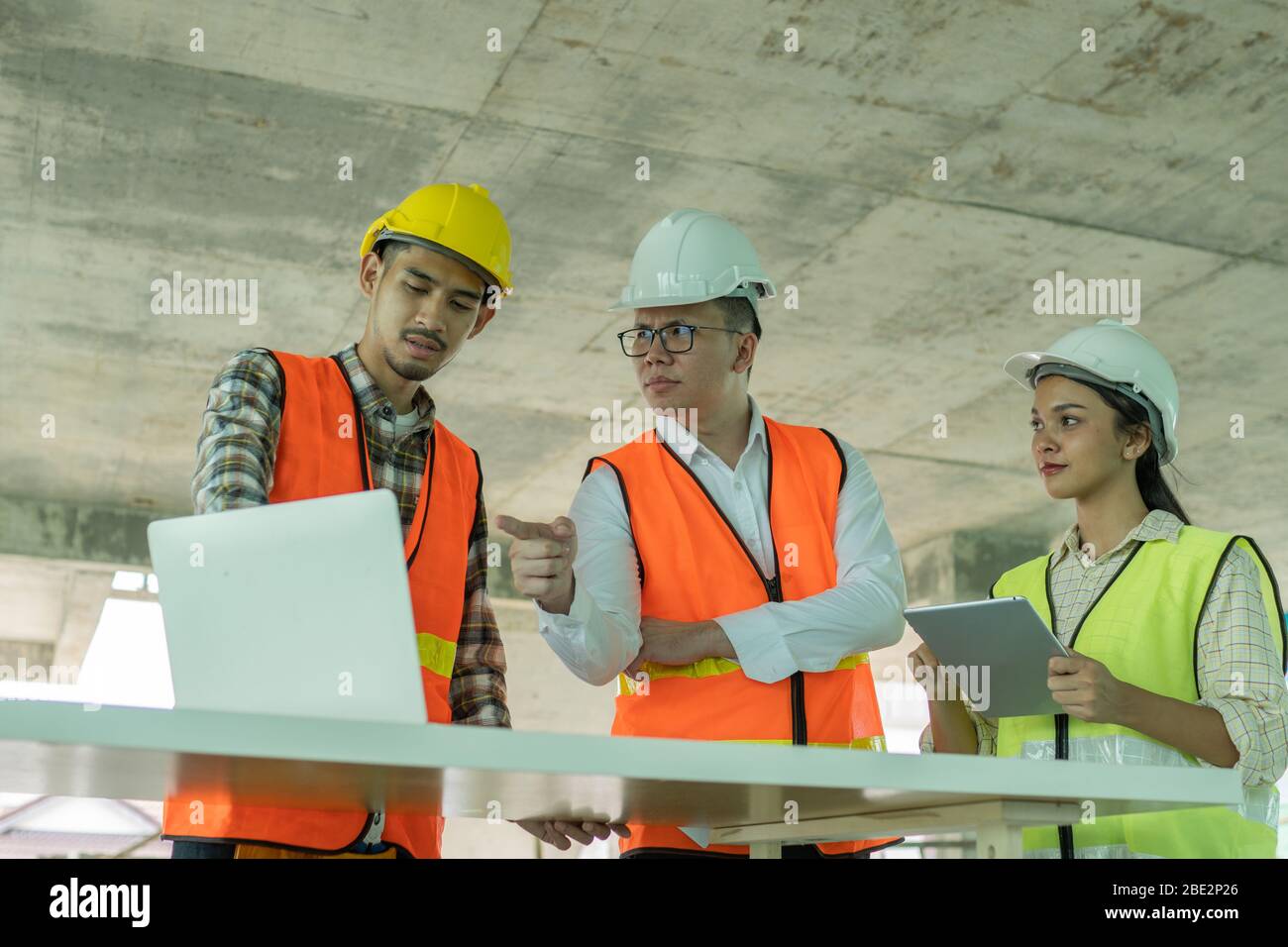 engineer planning with team architect with laptop on wood table in