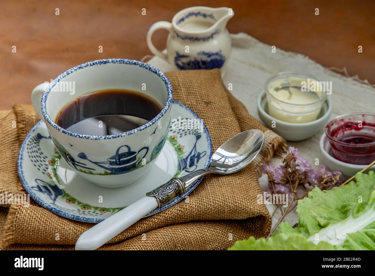 Black coffee with milk on sack cloth for new morning. Rrefreshing, Selective focuse. Stock Photo