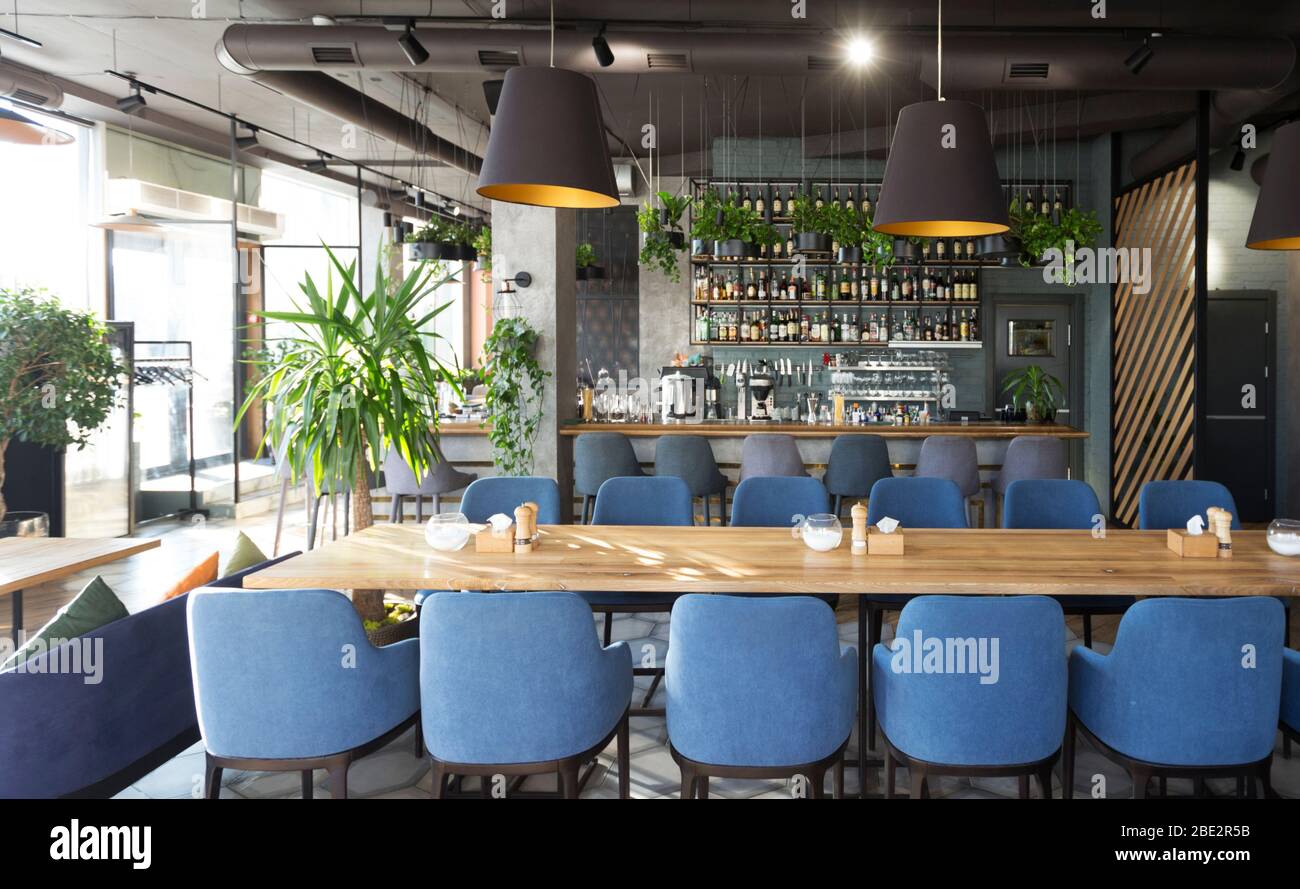 View on bar with wooden counter and chairs in Modern cafe Stock Photo