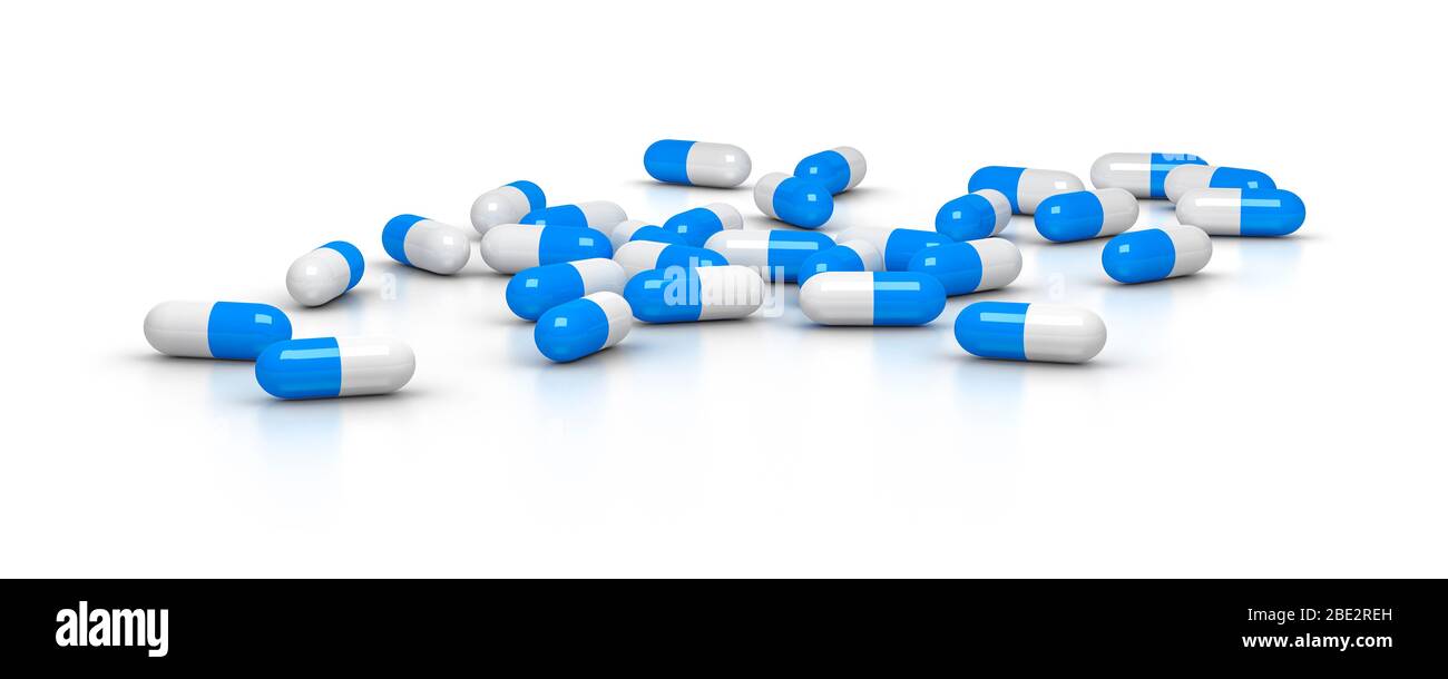 Eine Vielzahl blauer Tabletten vor weissem Hintergrund Stock Photo
