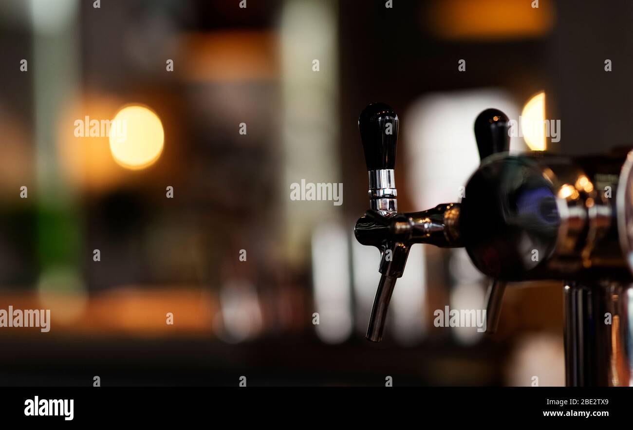 Close up detail beer cold tap in pub, selective focus Stock Photo