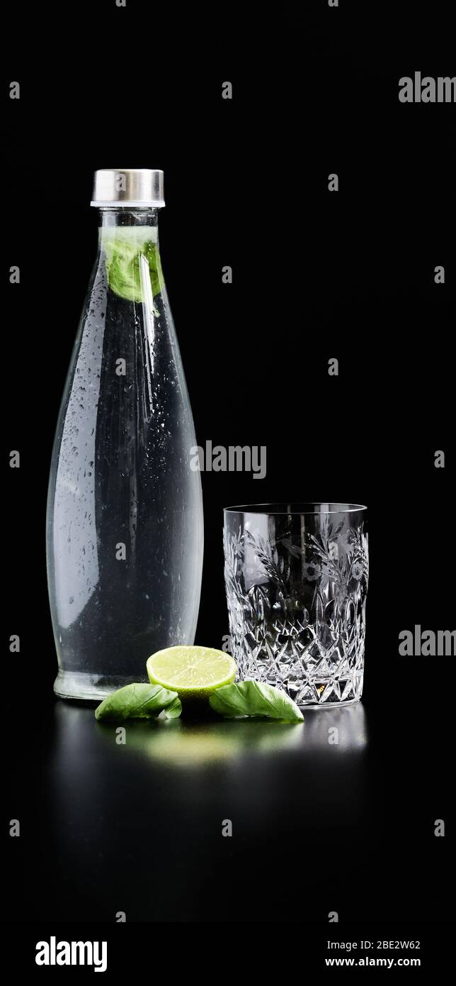 Fresh and healthy water with freshly squeezed lime juice and fresh basil Stock Photo