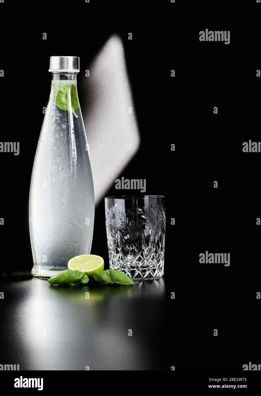 Fresh and healthy water with freshly squeezed lime juice and fresh basil Stock Photo