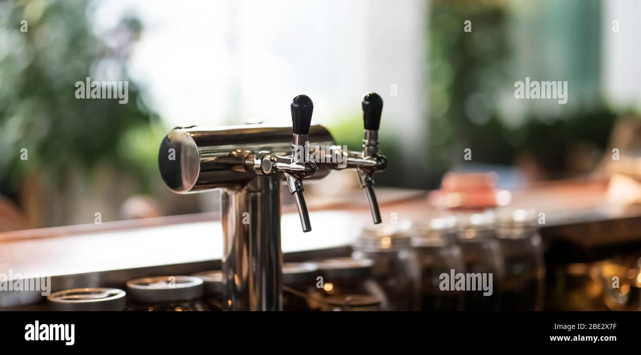 Beer tap in bar, mock up with selective focus, panorama Stock Photo
