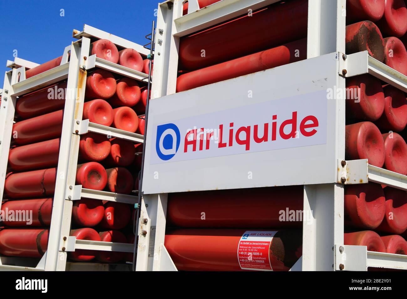 Mönchengladbach, Germany - April 10. 2020: Isolated logo of Air Liquide         gas company with red cylinders on truck Stock Photo