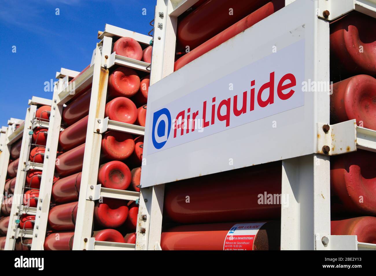 Mönchengladbach, Germany - April 10. 2020: Isolated logo of Air Liquide         gas company with red cylinders on truck Stock Photo