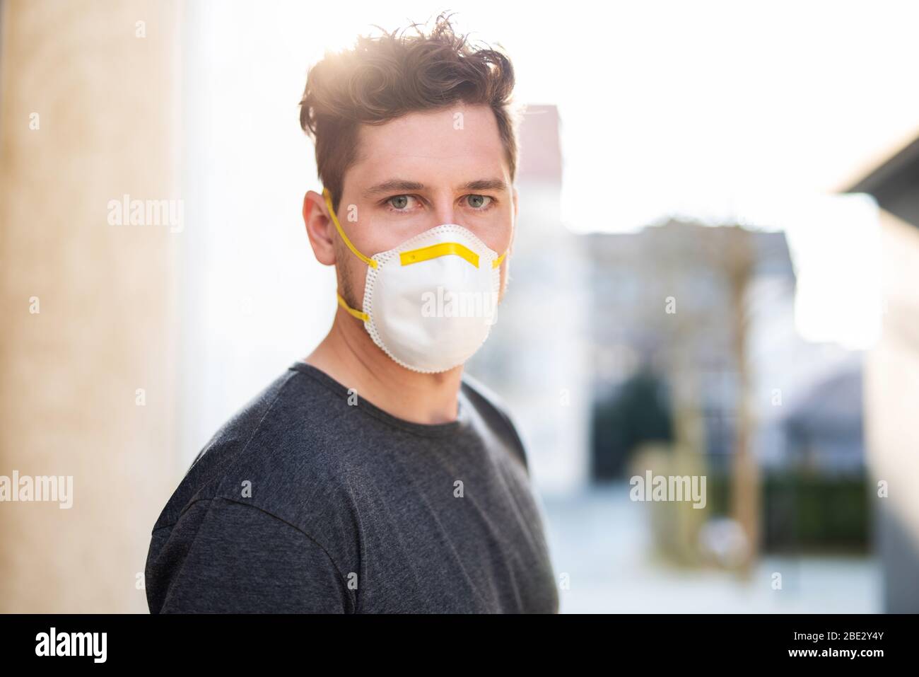 Portrait of a young man with breathing mask outdoors Stock Photo