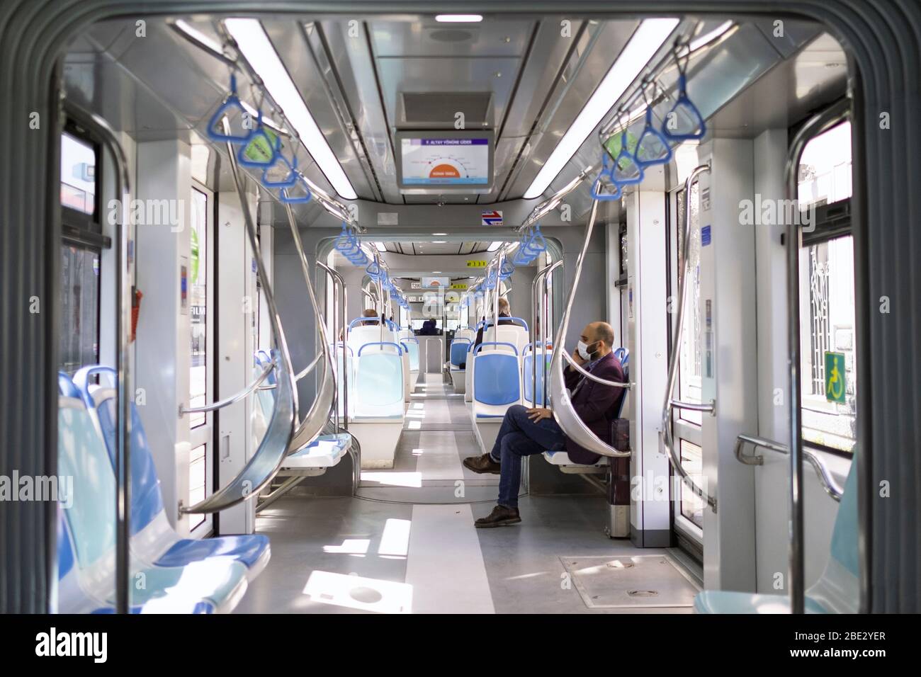 Izmir, Turkey - April 10, 2020:  Inside of Izmir Tram, Only a few people is transporting with it because of coronavirus pandemi quarentine. Stock Photo