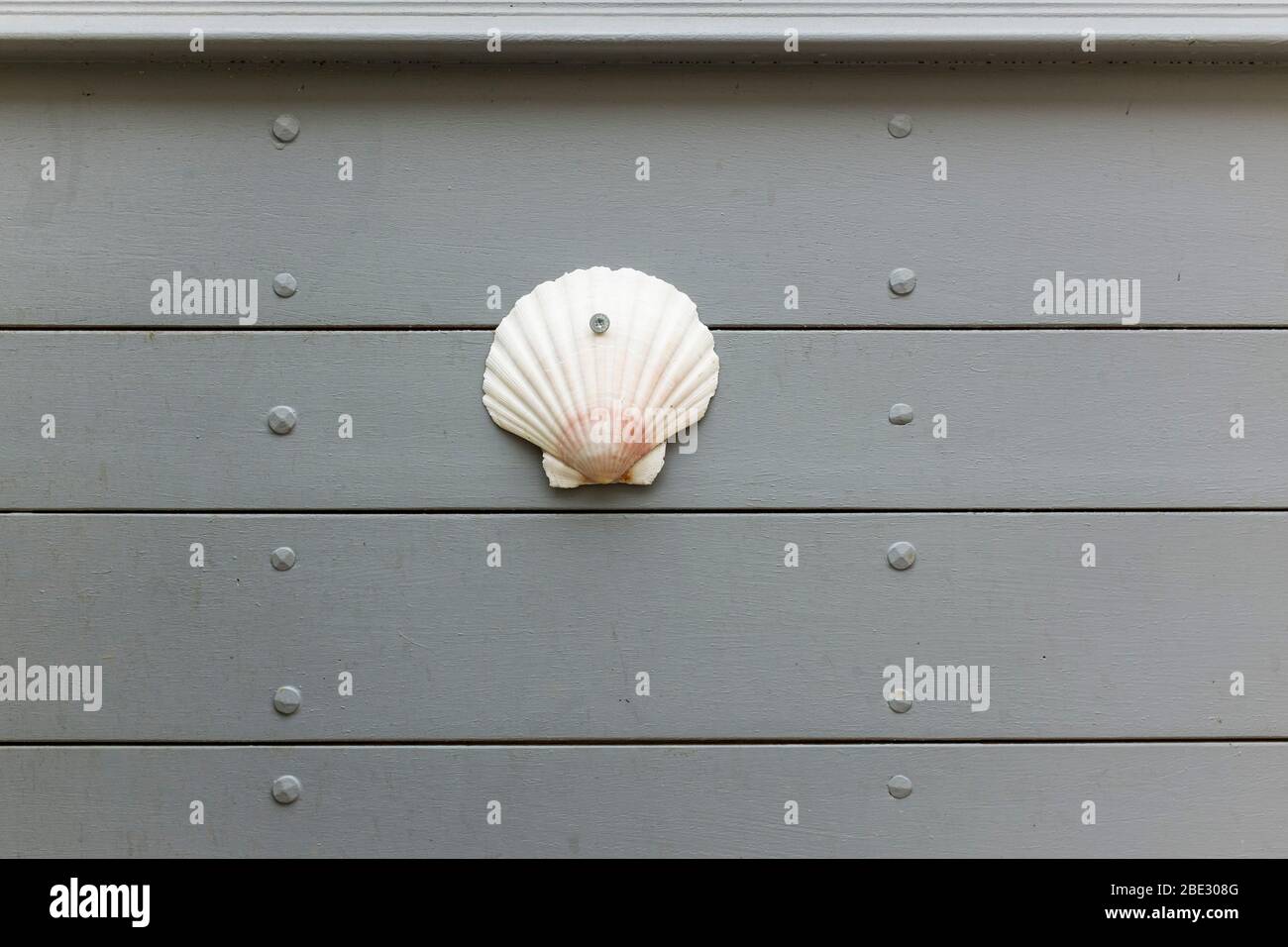 A scallop shell on a wall denotes the Camino de Santiago pilgrims ...