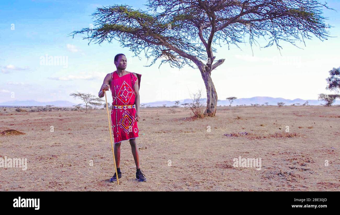 Maasai materials and fabrics with traditional patterns and designs sold on  a local market Stock Photo - Alamy