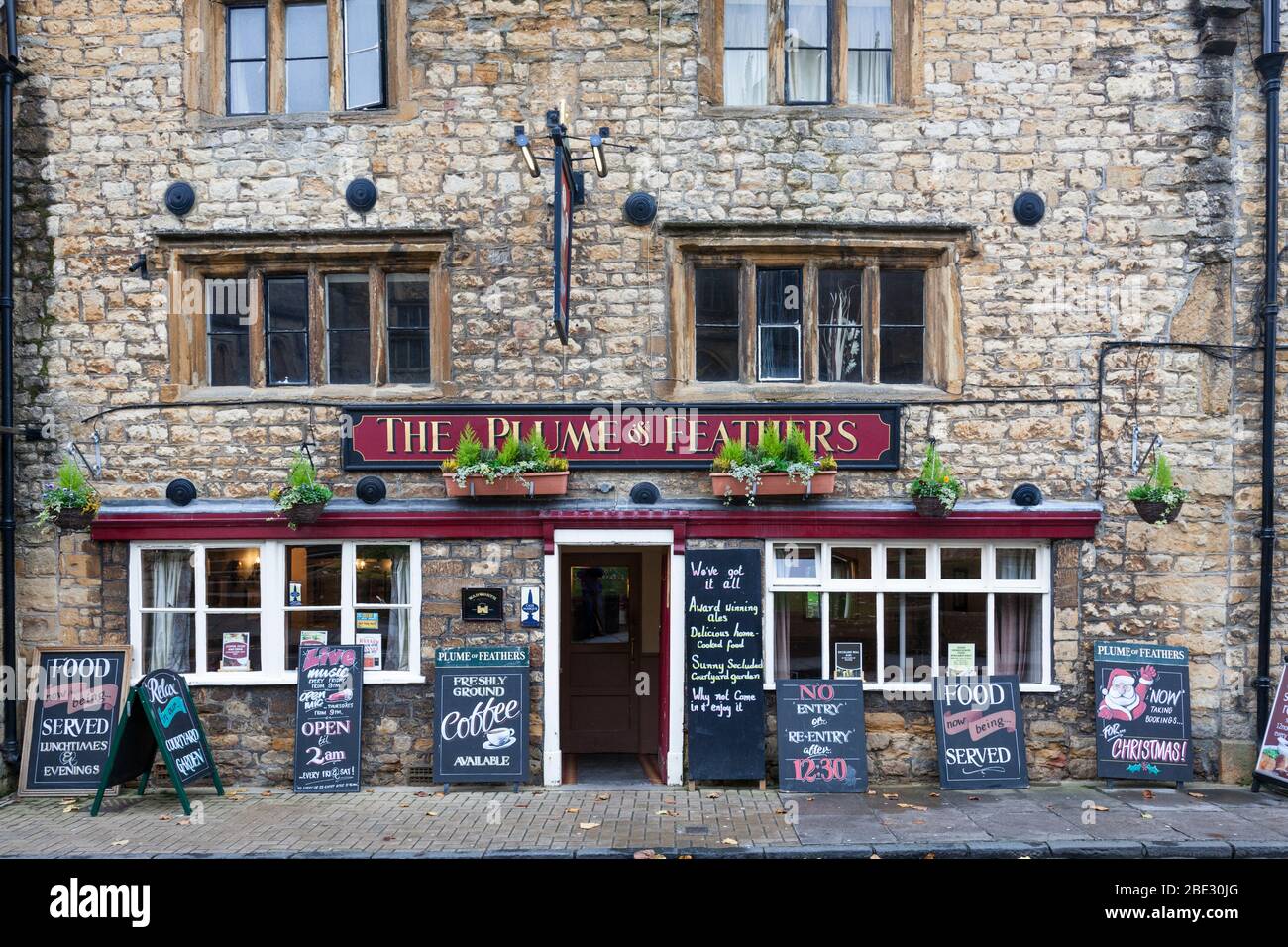 Dating from 1590, The Plume of Feathers is an historic inn opposite Sherborne Abbey, Dorset. Stock Photo