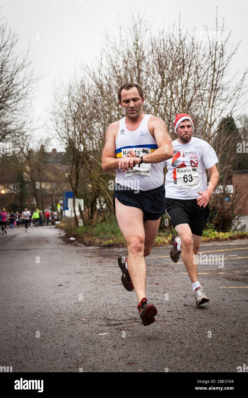 Men running in a Boxing Day race Stock Photo Alamy