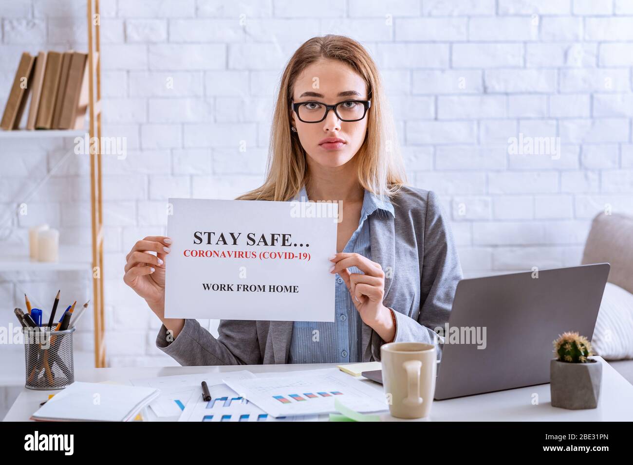 Stay Safe Working Woman asks stay safe, work from home Stock Photo - Alamy
