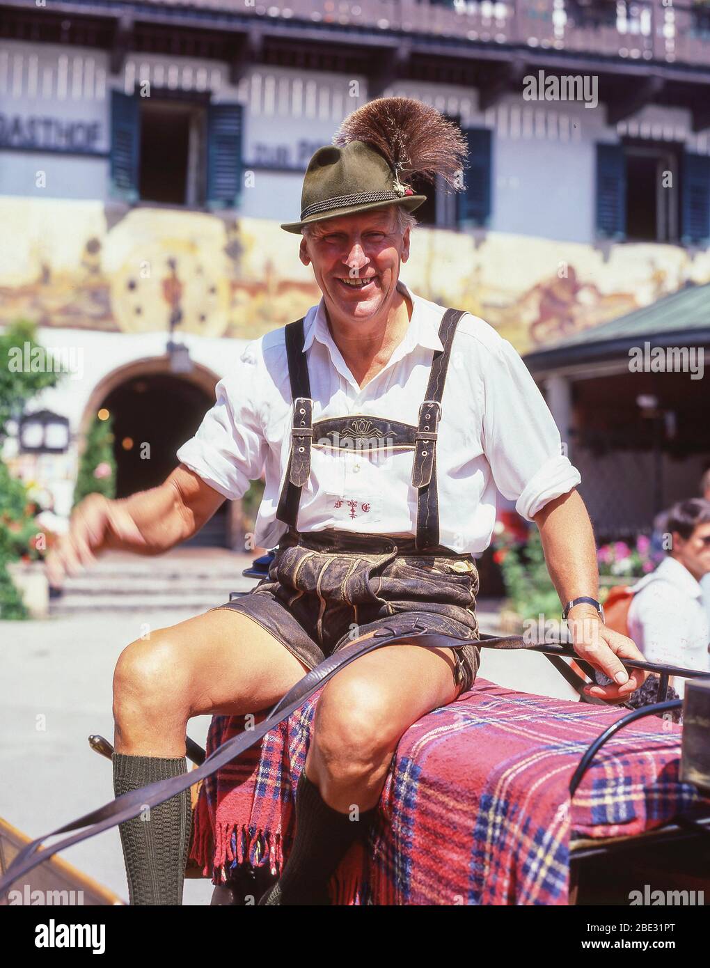 Horse carriage driver wearing Lederhosen pants, St Gilgen, Salzburg State, Republic of Austria Stock Photo