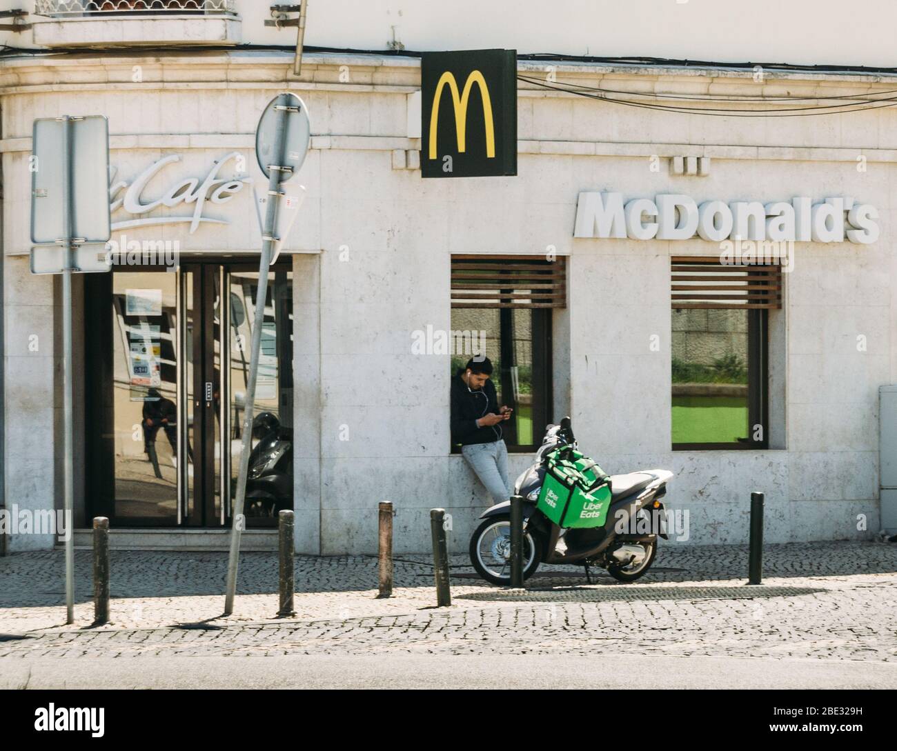 Cascais, Portugal - April 11, 2020: Glovo and UberEats delivery 