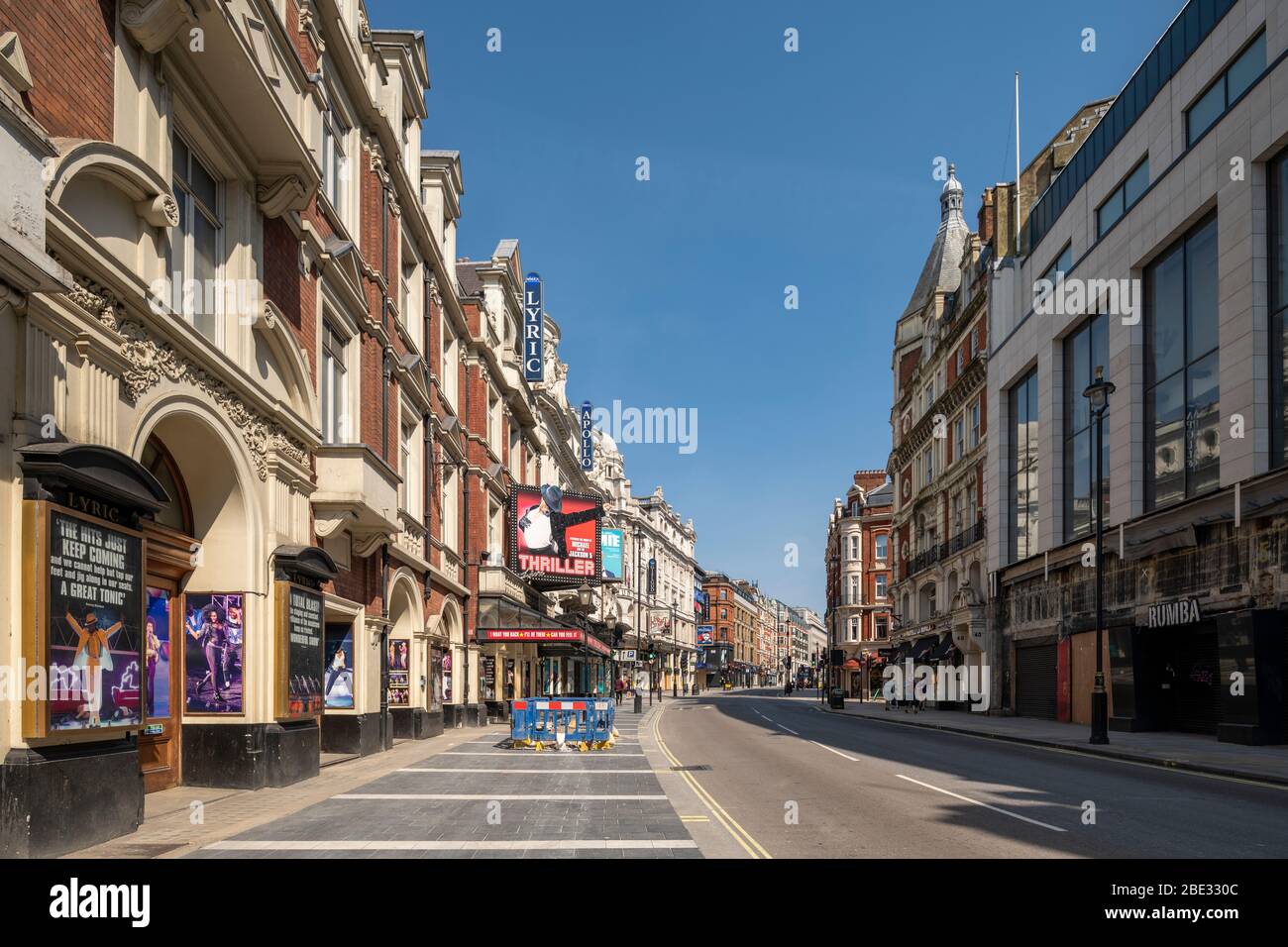 West-end of London theatre district street empty and quiet during the enforced lockdown due to the covid 19 coronavirus flu pandemic outbreak Stock Photo