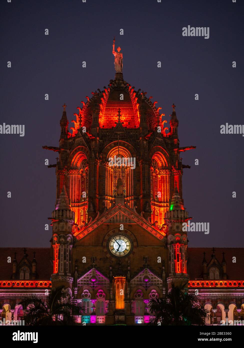 Chhatrapati Shivaji Terminus railway station (CSTM), a UNESCO World Heritage Site in Mumbai, decorated/illuminated in India flag color lights Stock Photo