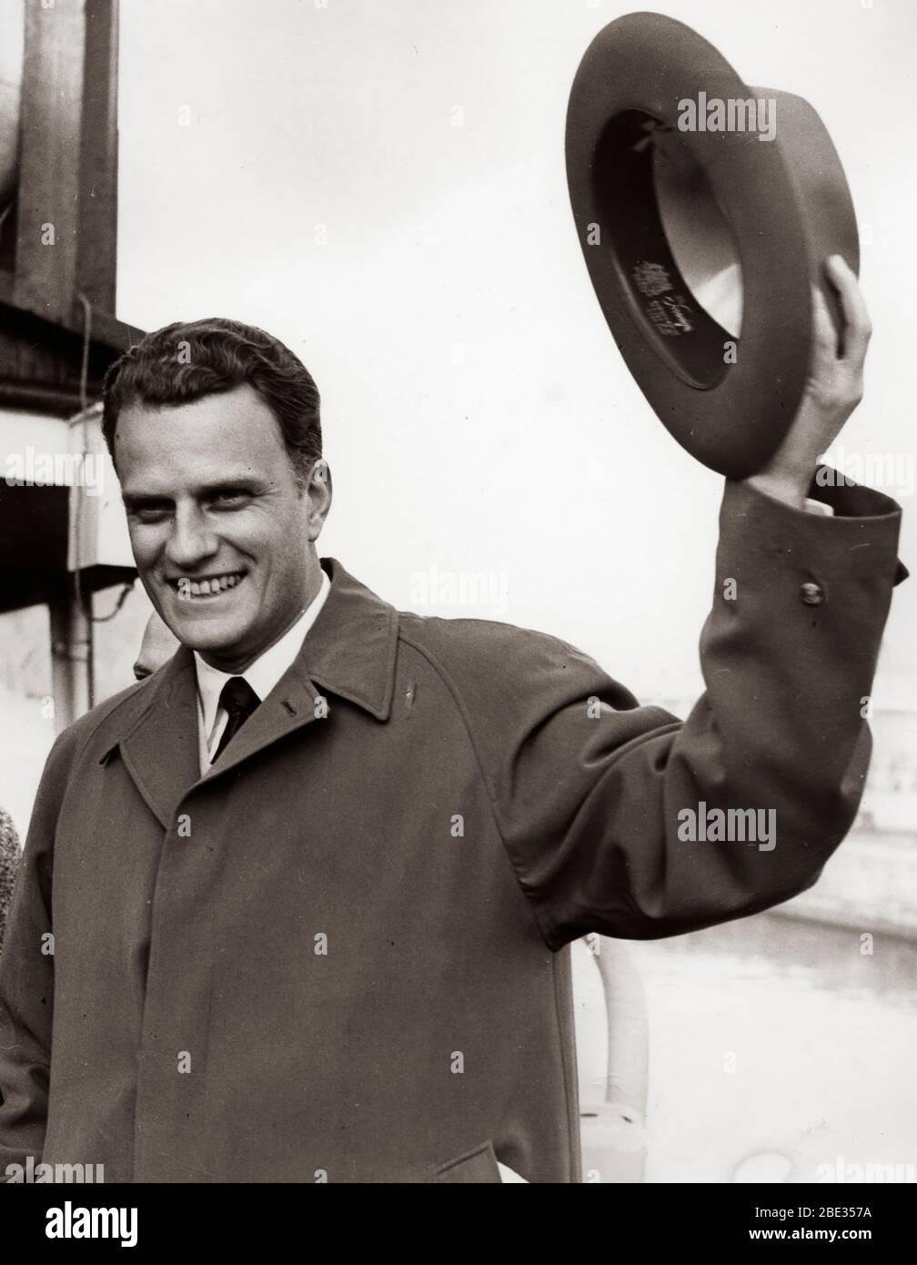 Oct. 2, 1960 - London, England, U.K. - BILLY GRAHAM, born William Franklin Graham, Jr., is an evangelical Christian reverend and evangelist. He gained fame due to his sermons being broadcast on the radio and television. PICTURED: Billy Graham at the airport. Stock Photo
